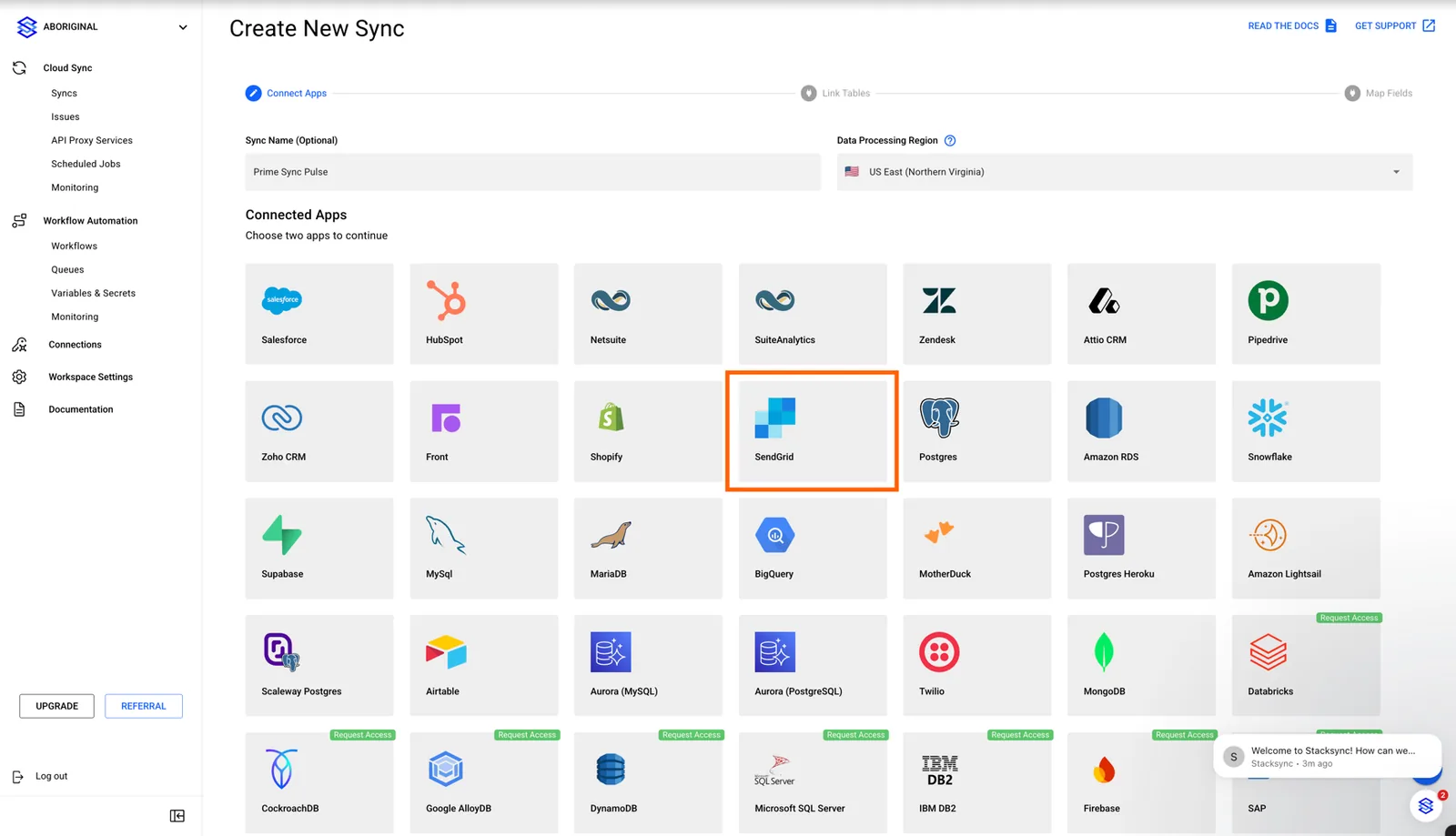 Stacksync "Create New Sync" Connected Apps grid with the SendGrid connector highlighted.