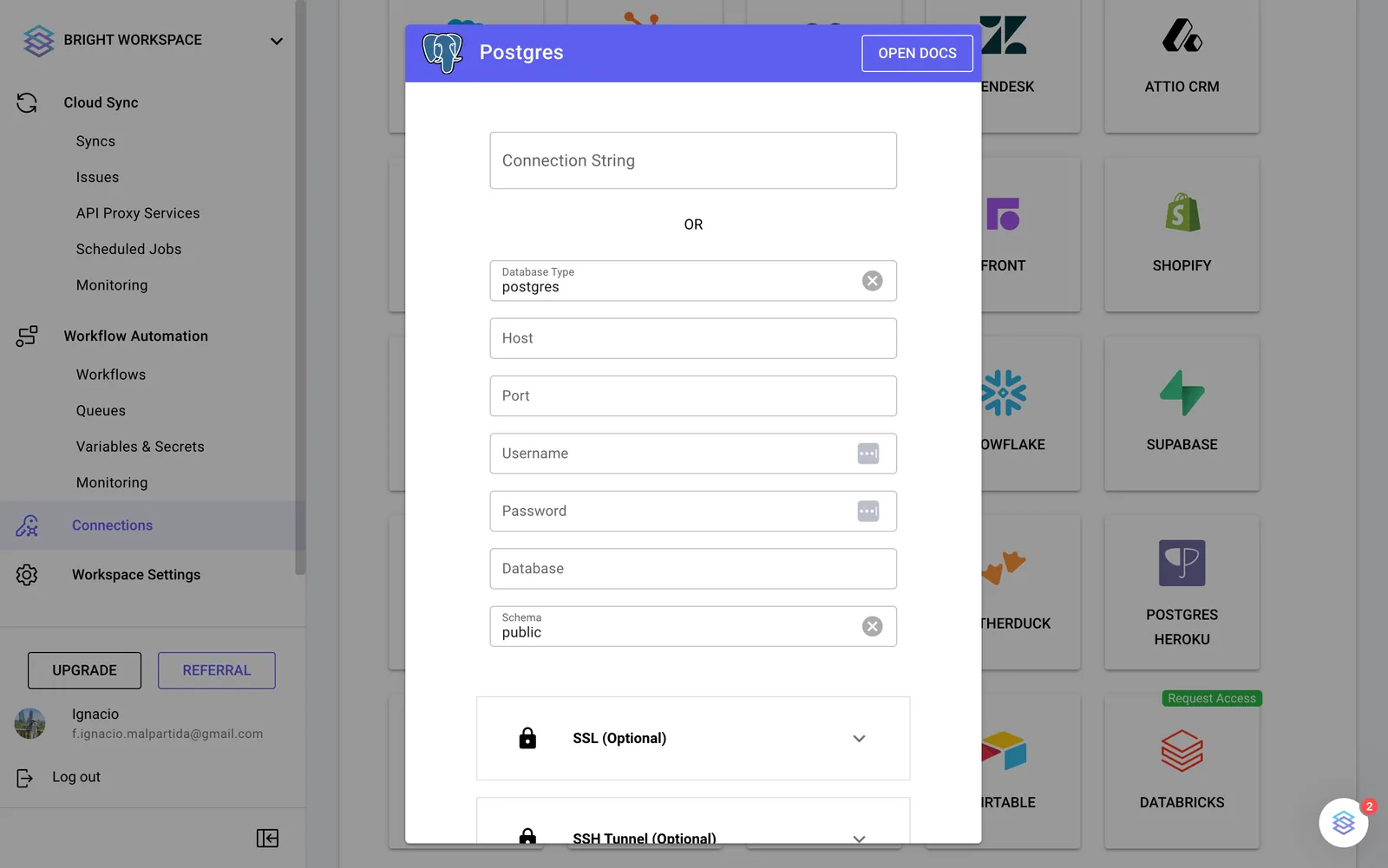 Stacksync Postgres connection dialog with Connection String or Database Type, Host, Port, Username, Password, Database and Schema fields.