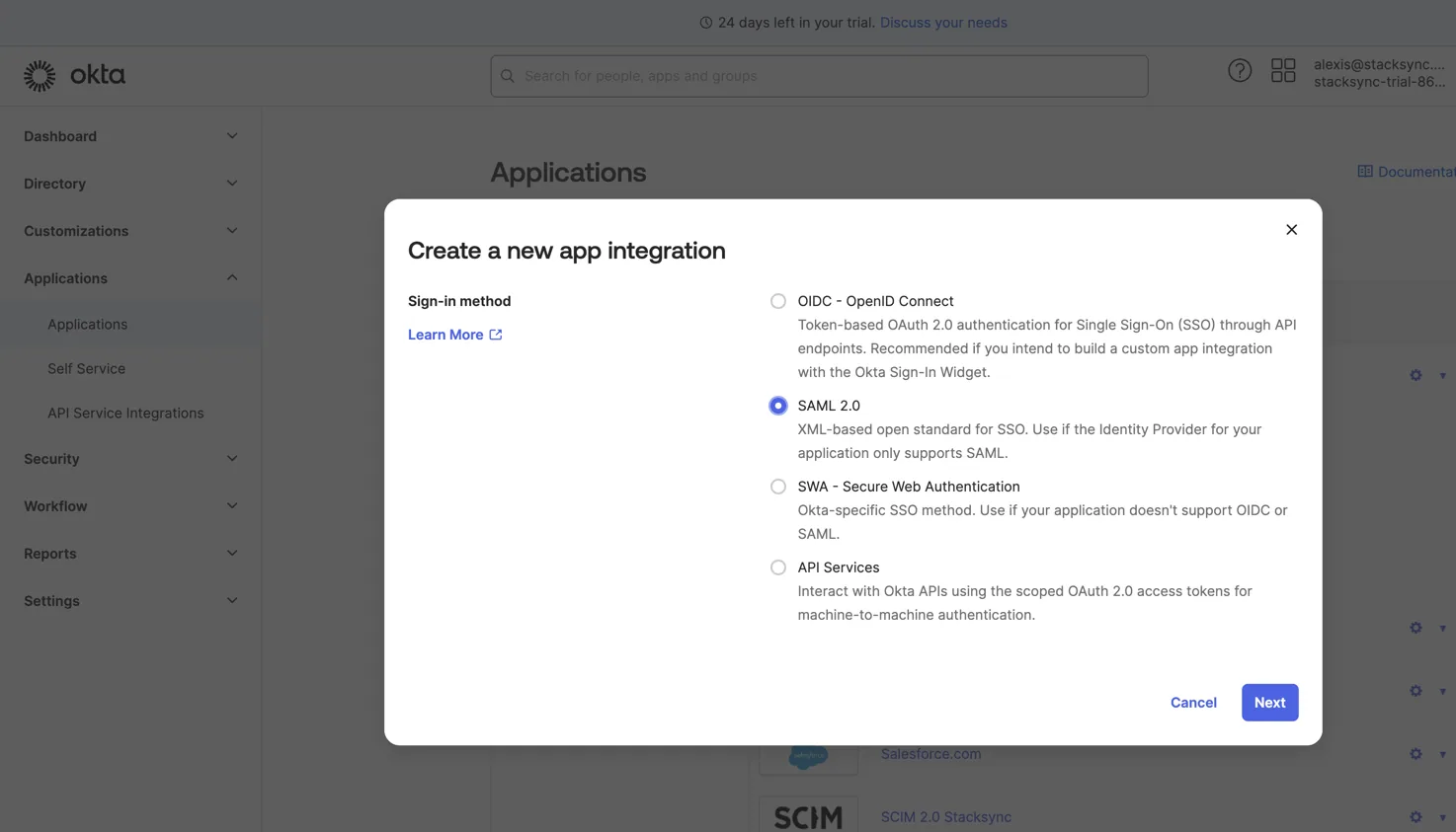 Okta "Create a new app integration" dialog with sign-in method "SAML 2.0" selected and a Next button.
