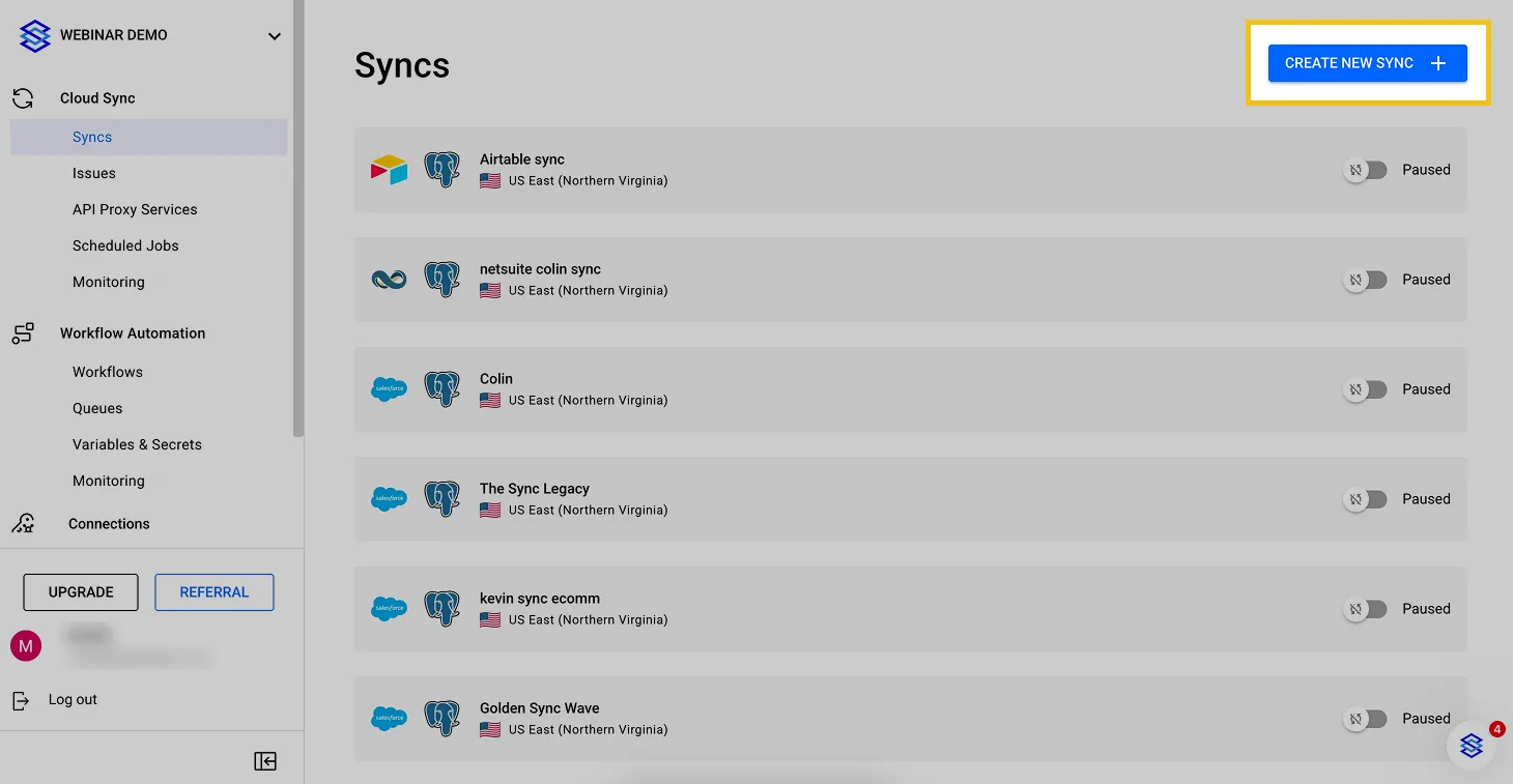 Stacksync Syncs dashboard listing paused syncs with the "Create new sync" button highlighted at top right.